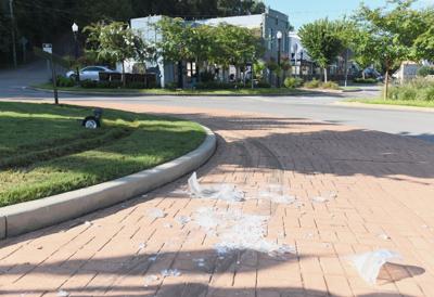 Cliff Williams / TPI A tractor trailer was driven the wrong way around the round about in downtown Wetumpka Tuesday morning. The incident damaged a sign and sod and destroy a light post.