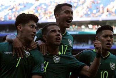 Bolivia forward Miguel Terceros (7) celebrates with teammates after scoring the goal that secured a 2-1 World Cup playoff victory over Suriname