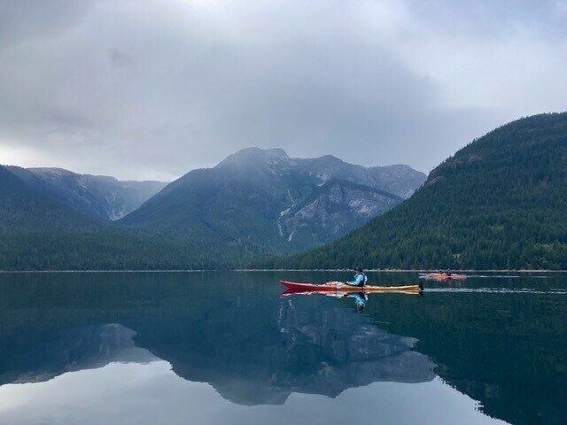 Two kayakers glide across a mountain lake wearing wet suits and life jackets. The Water Sports Foundation (WSF) recommends paddlers be prepared for very cold-water temperatures in spring. A wet suit or dry suit is a must when water temperatures are belo...
