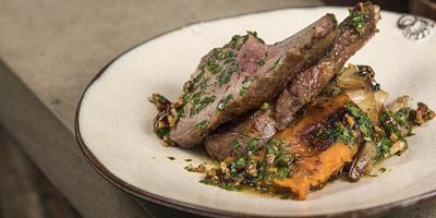 Roasted Double Cut Pork Chop, Braised Cabbage, Caramelized Sweet Potato and Pecan Vinaigrette