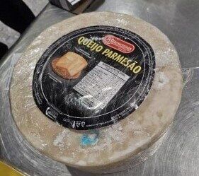 Woman tried to smuggle drugs worth £800k into UK – inside Parmesan cheese wheel