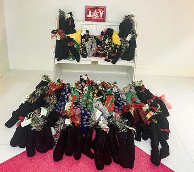 Methodist church donates socks to Russell Medical Cancer Center