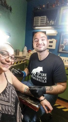 Tattoo shop owner feels his hand was forced to reopen before ready