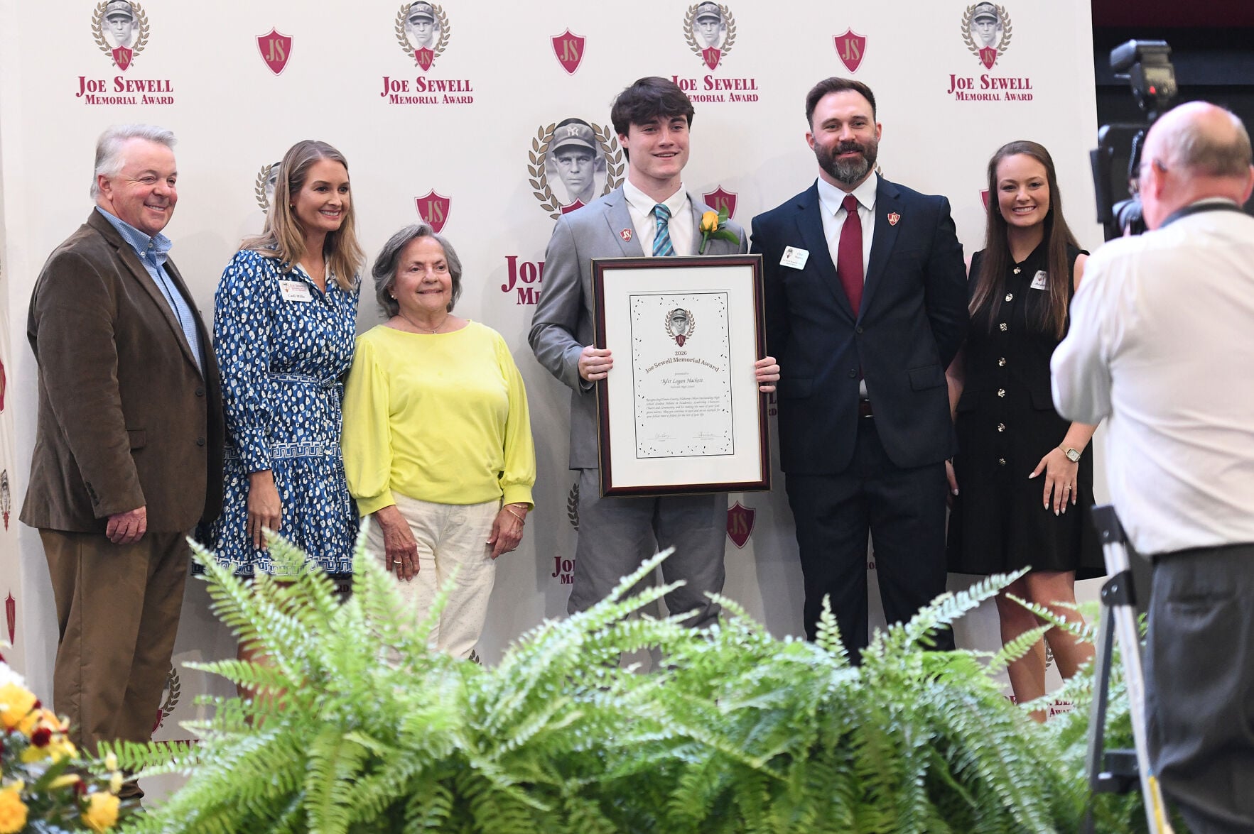 Cliff Williams / TPI Holtville High School senior Tyler Logan Hackett, center, poses with members of the Joe Sewell Memorial Award board after being named the 2026 overall girls winner.