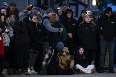 Community members attend a vigil to honor victims of the Tumbler Ridge mass shooting