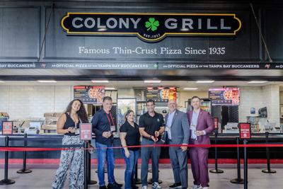 From left: Demery Zachery (Tampa Bay Buccaneers); Frank Speranzo, Monna Robles and Paul Coniglio (Colony Grill); and Marc Budine and Jordan Bellar (Tampa Bay Buccaneers) outside a new Colony Grill concession stand on the 100 Level at Raymond James Stadium.