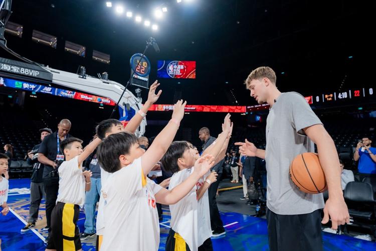 Current players from the Dallas Mavericks and Houston Rockets join local students at The Venetian Arena Oct. 8 for a basketball clinic and to assemble goodie bags on Tip-Off Day, the second event of the Impact Week. The event attracted approximately 400...