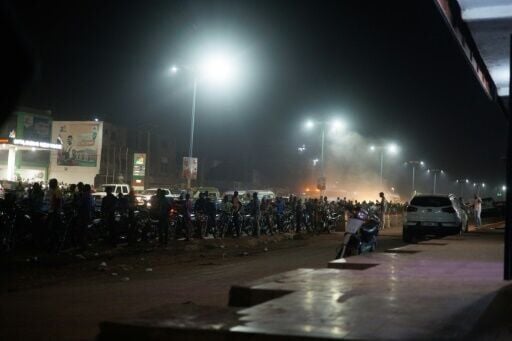 Vehicles queue for petrol at a service station in Bamako on October 27, 2025