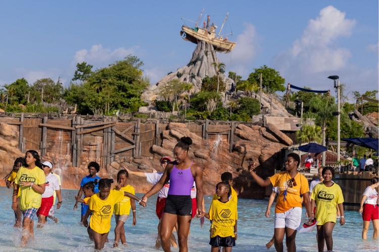Olympic gold medalist Simone Manuel joins children from Boys & Girls Clubs of Central Florida in the wave pool during the World's Largest Swimming Lesson™ at Disney's Typhoon Lagoon Water Park in Orlando, Florida. The park welcomed more than 600 childre...