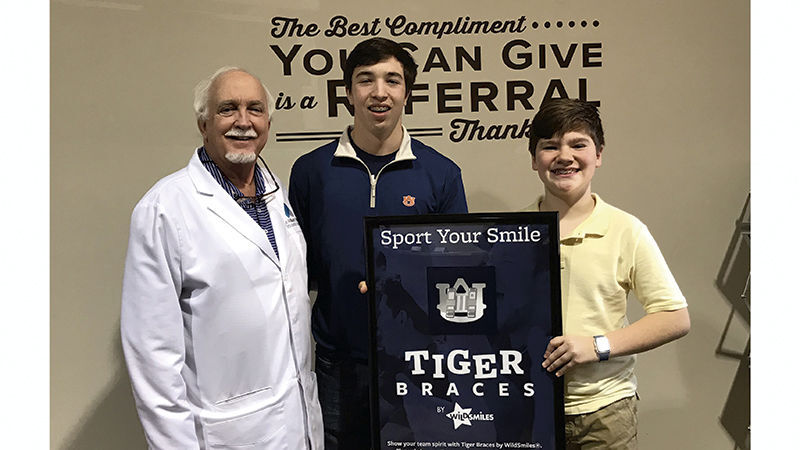Tiger Teeth: Local orthodontist installs Auburn braces for pair of patients