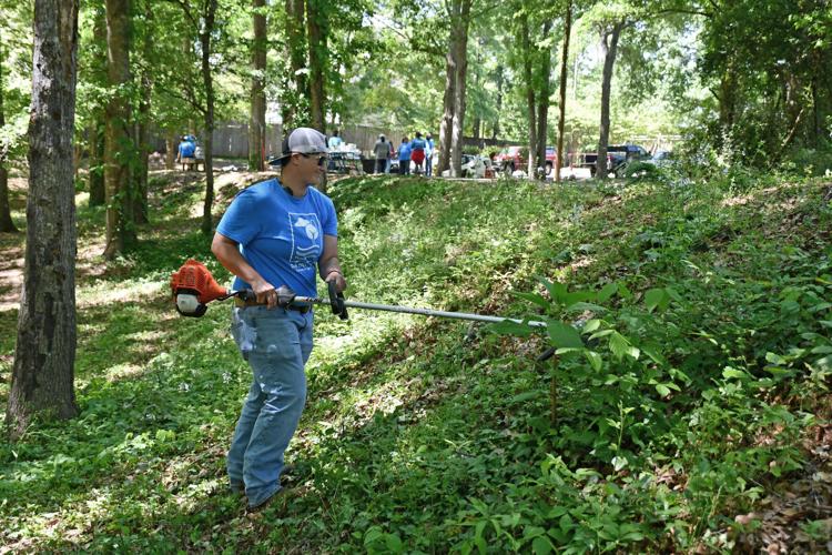 PHOTOS: Hellas Fibers and Beautification Board volunteers spruce up Keebler Park