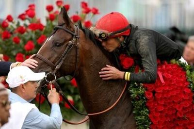 Jockey Jose Ortiz celebrates his Kentucky Derby victory aboard Golden Tempo