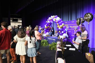 Cliff Williams / TPI After the ceremony, family and friends took more photos of their seniors at Tallassee High School who are going into the military or received scholarships through band, choir or art to further their education.