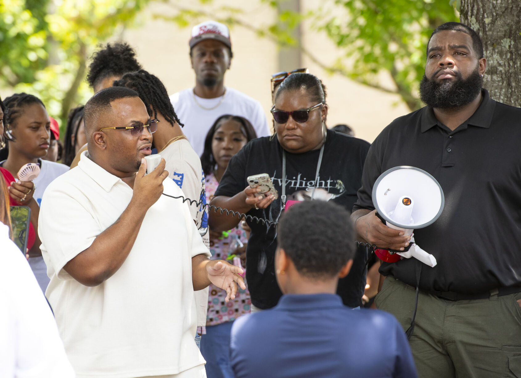 PHOTOS: Residents gather for murder victim and justice