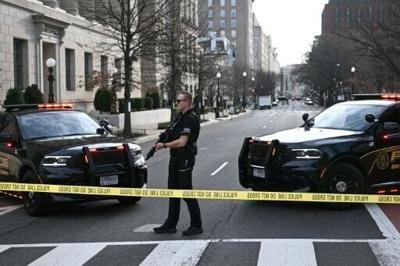 A US Secret Service agent stands watch after a vehicle smashed a security barricade near the White House on March 11, 2026