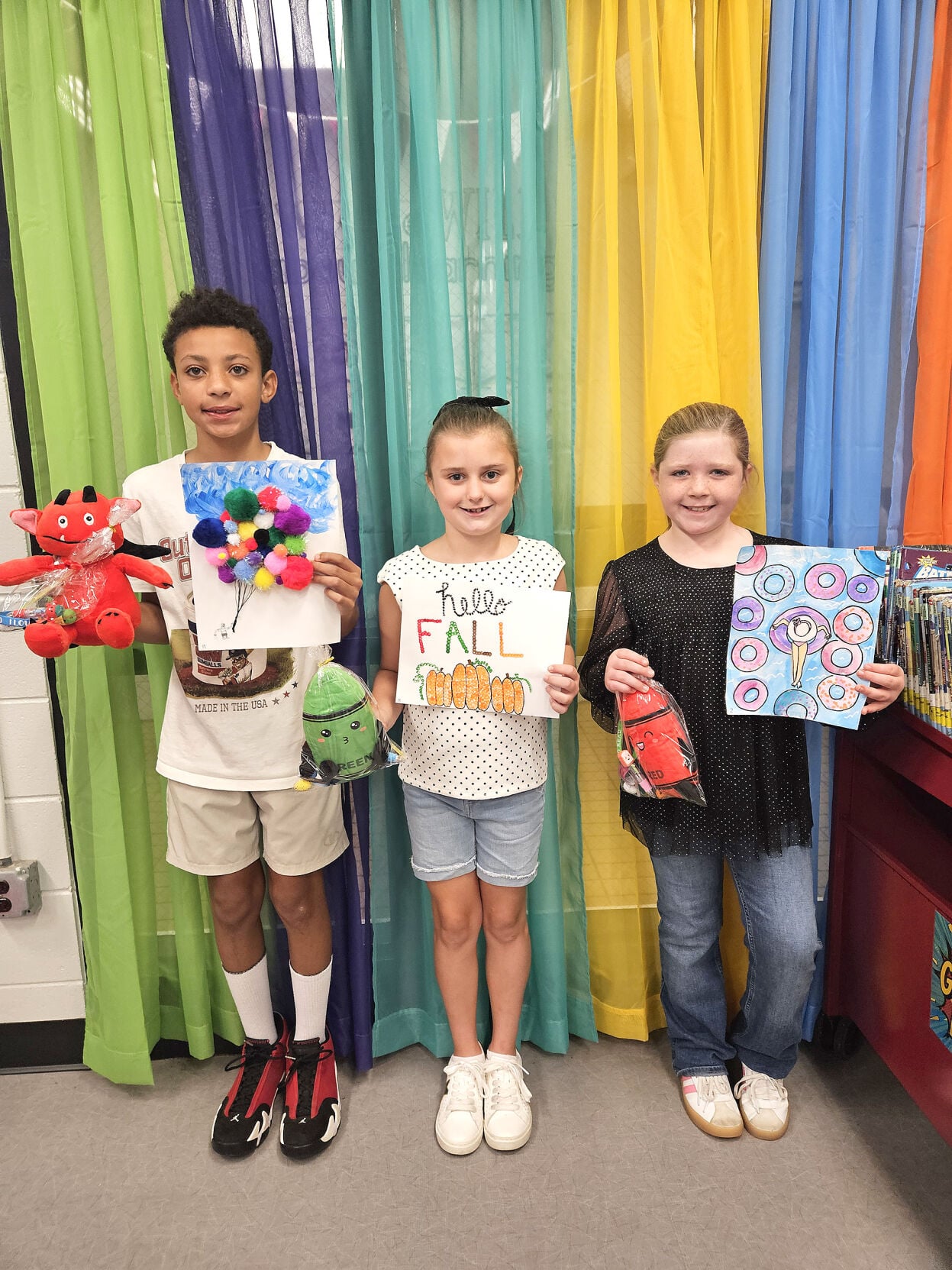 Cliff Williams / TPI Some of the winners of the Eclectic Elementary School library Dot Day Art Contest pose for a photograph.