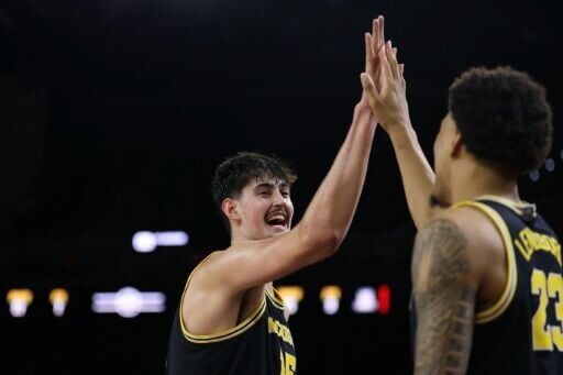 University of Michigan teammates Aday Mara and Yaxel Lendeborg react during the team's victory over the University of Arizona in the NCAA collegiate basketball touranment Final Four