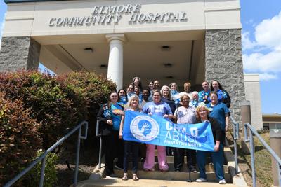 Cliff Williams / TPI Blue shirts and pinwheels adorned the staff and desks at Elmore Community Hospital this month. It was not meant to provide just decoration. The blue shirts and pinwheels marked the staff of the hospital as honoring April as Child Abuse Prevention Month. It also stood as a symbol the staff would support children and those who work to prevent child abuse.