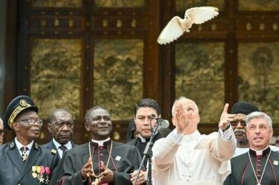 Pope Leo XIV releases a white dove after calling for peace in Cameroon