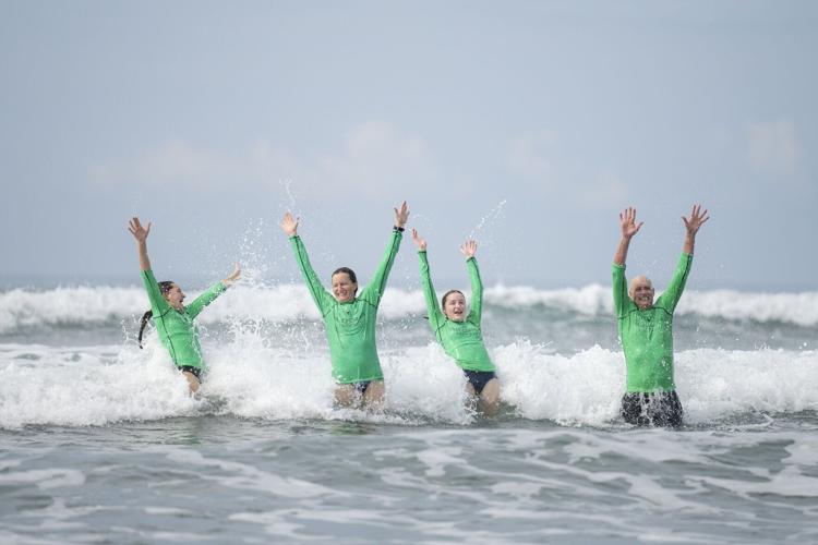 Guests playing in the water on a Backroads active adventure in Costa Rica.