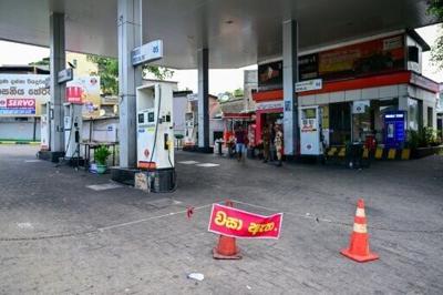 A sign reading 'closed' is displayed at a fuel station in Kotahena on the outskirts of Colombo