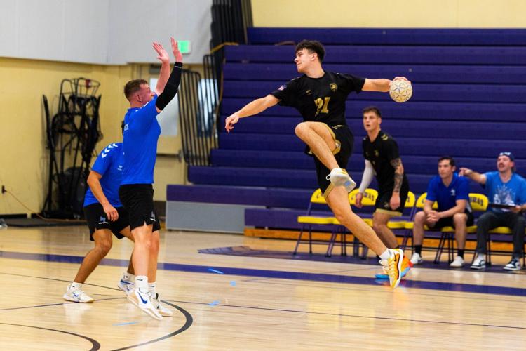 An athlete soars past a defender during the Commander-in-Chief's Trophy match, part of the celebration launching the strategic partnership between USA Team Handball and Indian River State College that establishes a National Training Center on Florida's ...