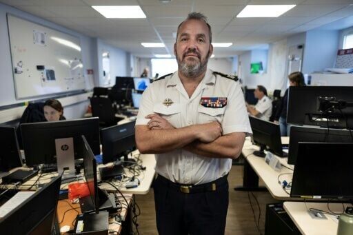 Commanding officer Thomas Scalabre oversees the monitoring
