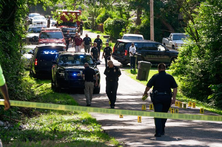 Alexander City police officers work the scene of a shooting on N street