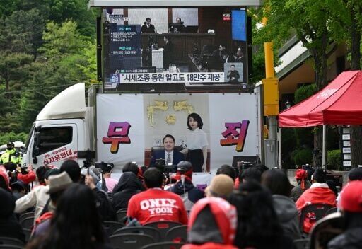 Supporters watch a live stream of the trial of South Korea's former first lady Kim Keon Hee, who has had her prison sentence for corruption increased on appeal