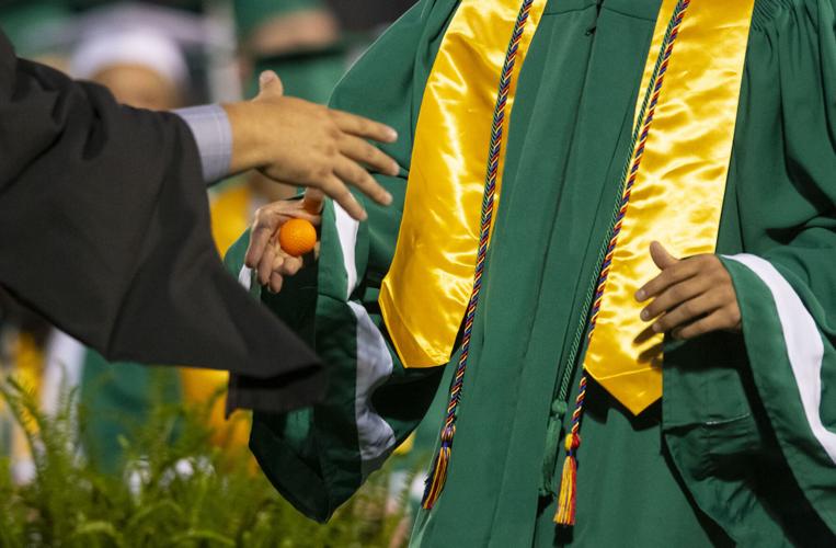 PHOTOS: Golfball handshake for graduation