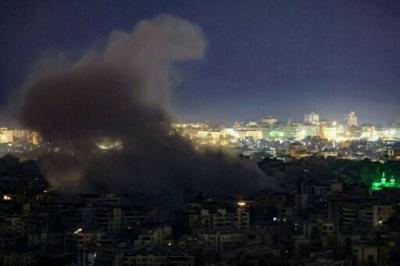 Smoke rises from the site of an Israeli airstrike in Beirut’s southern suburbs