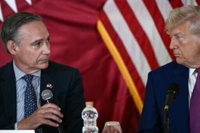 Boeing CEO Kelly Ortberg (L), seen with President Donald Trump during a May 2025 visit to Qatar, says the company's certification efforts remain on track