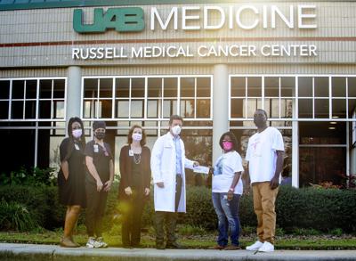 Family donates proceeds of walk to cancer center