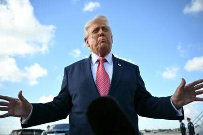 US President Donald Trump speaks to the press upon arrival at Miami International Airport in Miami