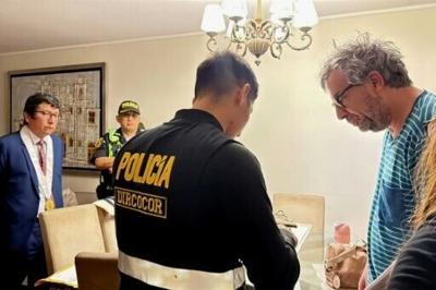 Police have raided the home of Peru's former election body head, following a chaotic presidential vote