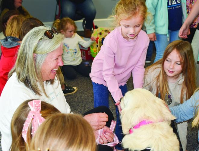 Auburn Therapy Dogs visit children’s library