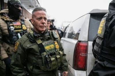 US Border Patrol commander Gregory Bovino walks to his vehicle at a gas station in Minneapolis, Minnesota on January 21, 2026