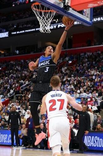 Orlando's Desmond Bane flies to the basket in the Magic's victory over the Detroit Pistons in their NBA playoff opener