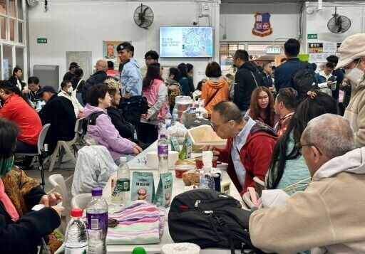 Residents take refuge in a temporary shelter near the Wang Fuk Court residential estate in Hong Kong's Tai Po district