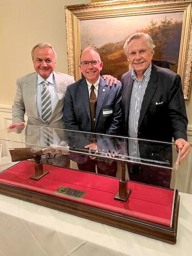 Anthony Imperato, Henry Repeating Arms Founder & CEO (L); Tom Schultz, Chief of the USFS (M), W. Grant Gregory Sr., NFF Chairman Emeritus (R), in front of the H11 New Original Henry NFF Edition rifle.
