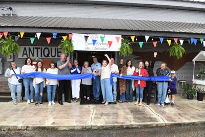 Cliff Williams / TPI Town of Eclectic officials joined staff from Vintage Antiques as they cut the ribbon on the new business Saturday.