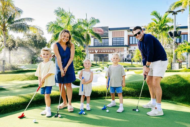 Family mini golfing at PopStroke