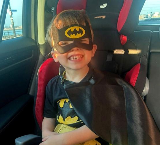 Boy dressed as Batman helps save man from rising tide after spotting frantic waving