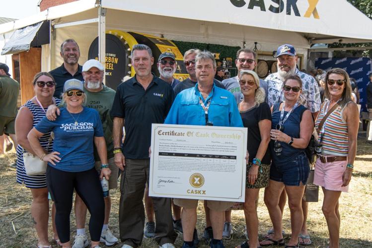 Paul Jones celebrates winning a 2026 Jackson Purchase Distillery bourbon barrel during the CaskX Barrel Competition at the 2026 Kentucky Bourbon Festival. CaskX CEO Jeremy Kasler joined Jackson Purchase Distillery representatives Nichole Beam and Andrew...