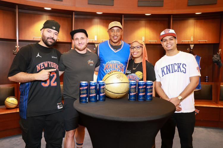 Knicks legend John Starks surprised select fans with an early look at the commemorative cans inside the Knicksā locker room as part of the āChampions Deserve Pepsiā launch