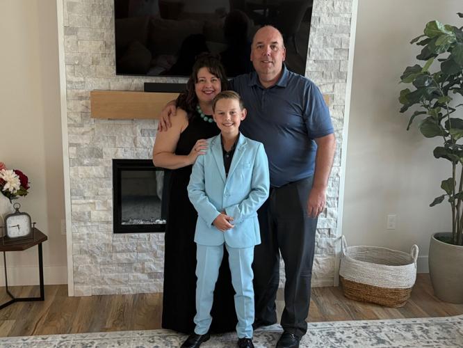 Andrea Deatrich (left), Dylan Deatrich (center), and David Deatrich (right), the family behind the upcoming Replay Sports Cards location in Salina, Kansas.