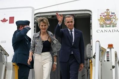 Canada's Prime Minister Mark Carney and his wife Diana Fox Carney arrive at Sydney Airport on March 3, 2026.