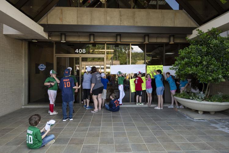 PHOTOS: Children, parents protest for kids to play ball