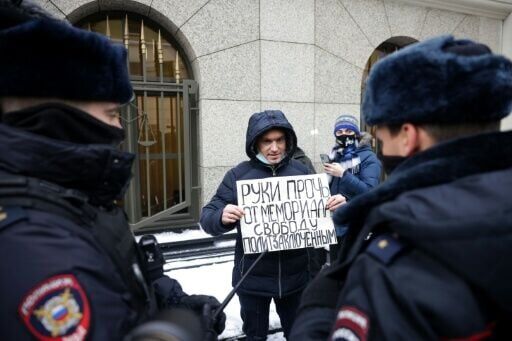 One protester stood outside the supreme court with a placard reading 'Hands off Memorial. Freedom to politial prisoners'