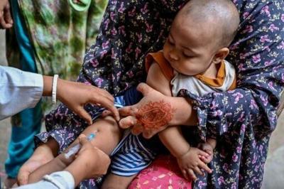 A child receives a dose of measles-rubella vaccine in Dhaka on April 12